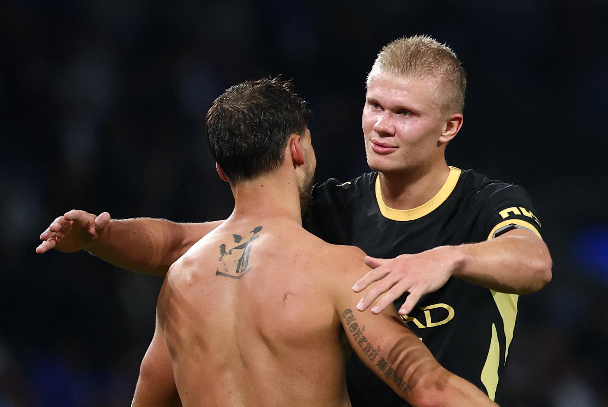Manchester City's Erling Haaland and Ruben Dias celebrate after the match.