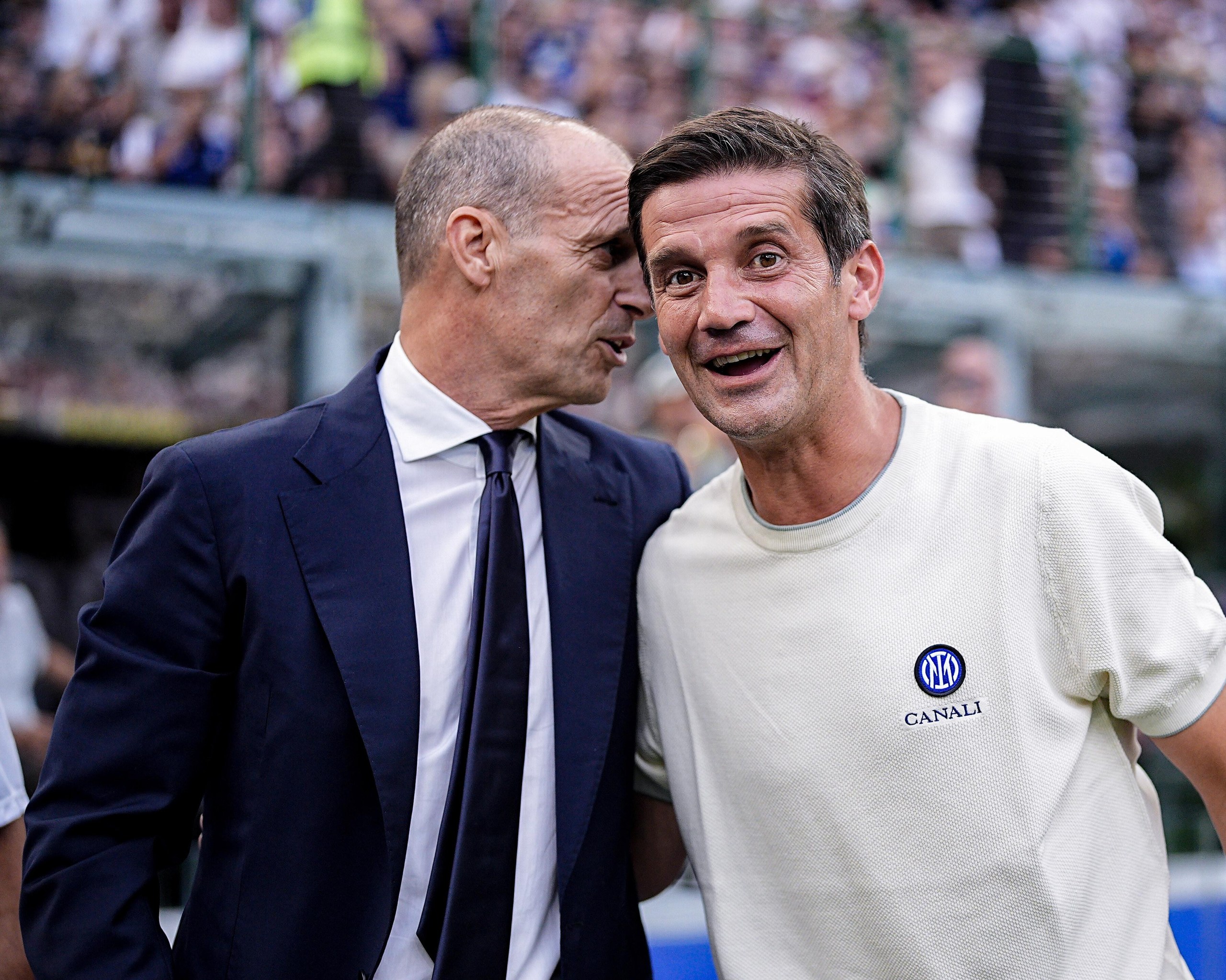 Massimiliano Allegri and Cristian Chivu greet each other before the Serie A match between Inter and Napoli