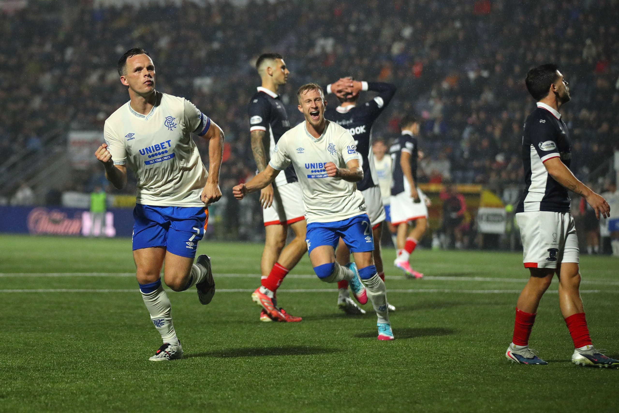 Lawrence Shankland runs with a clenched fist in celebration