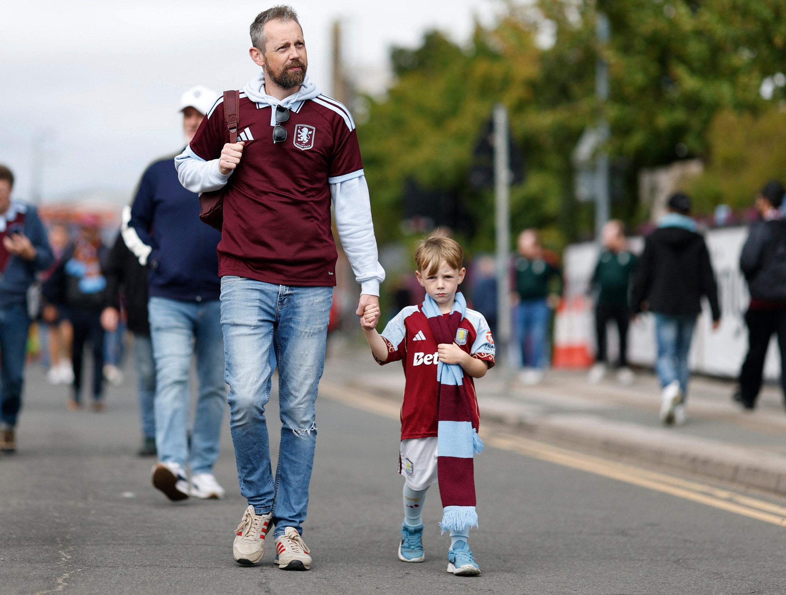 A couple of fans walk to Villa Park hoping to see their team score their first league goal of the season in four matches