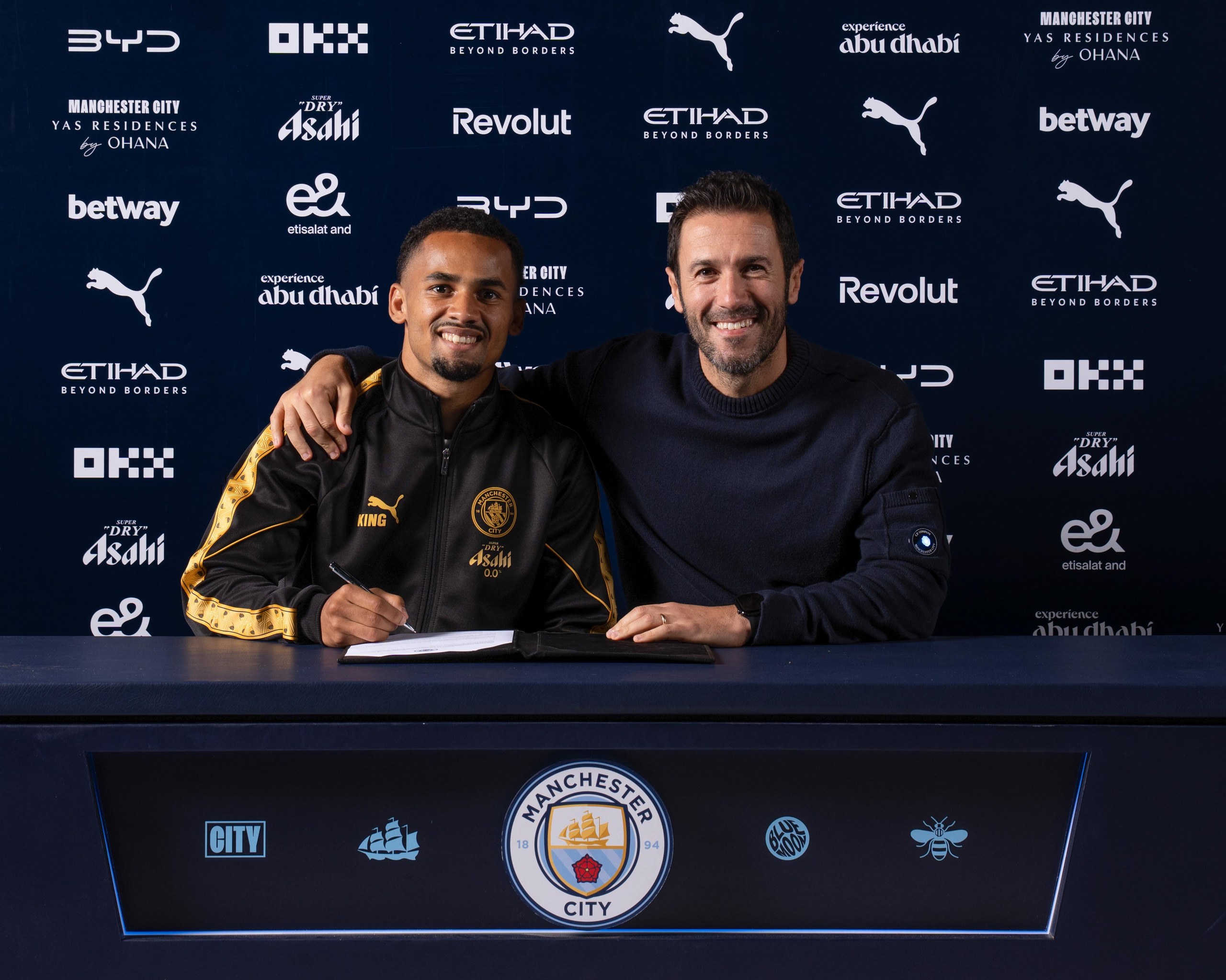 Iliman Ndiaye and the Manchester City sporting director, Hugo Viana.