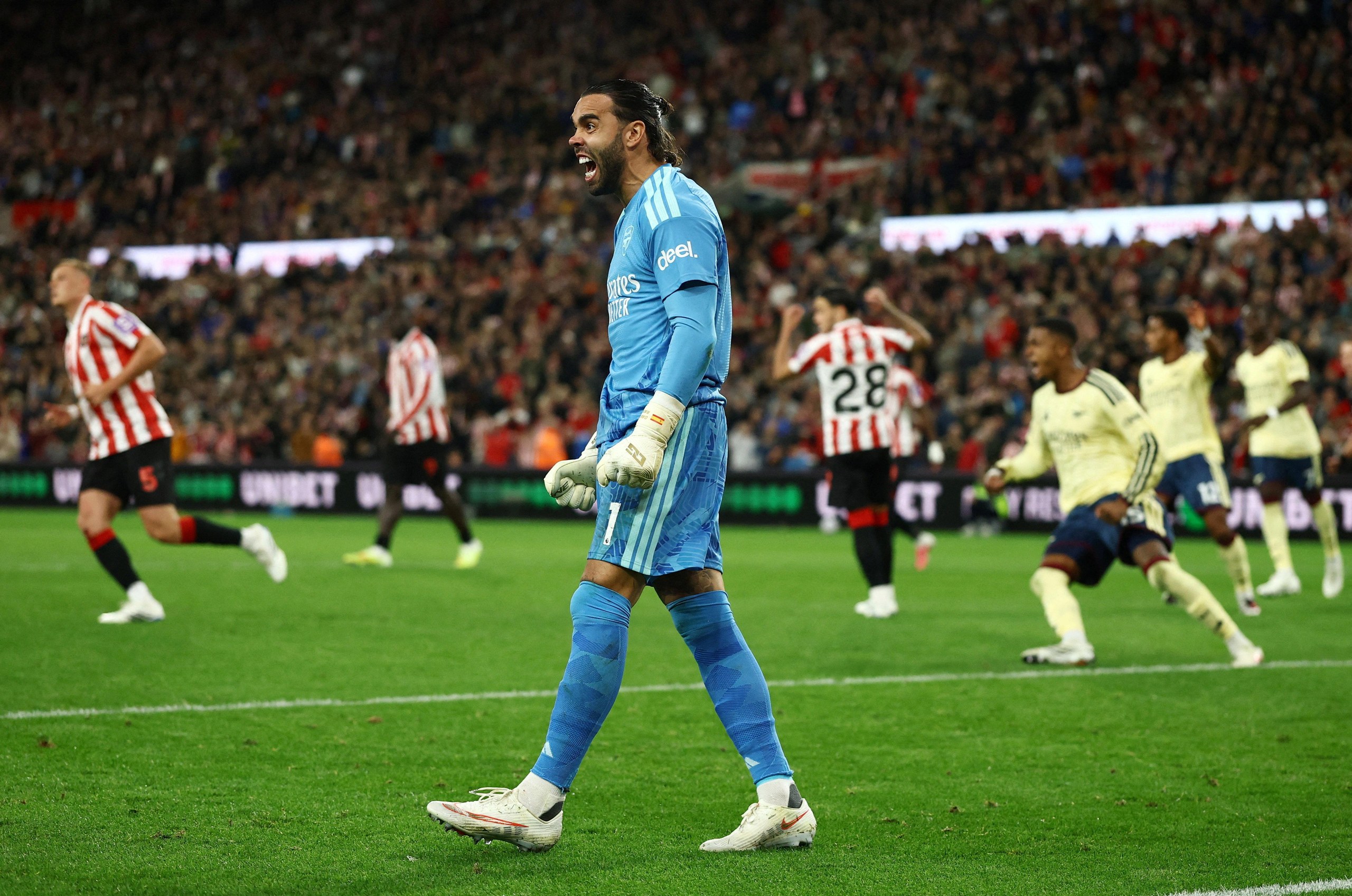 Arsenal's David Raya celebrates after saving a penalty missed by Sunderland's Enzo Le Fee.