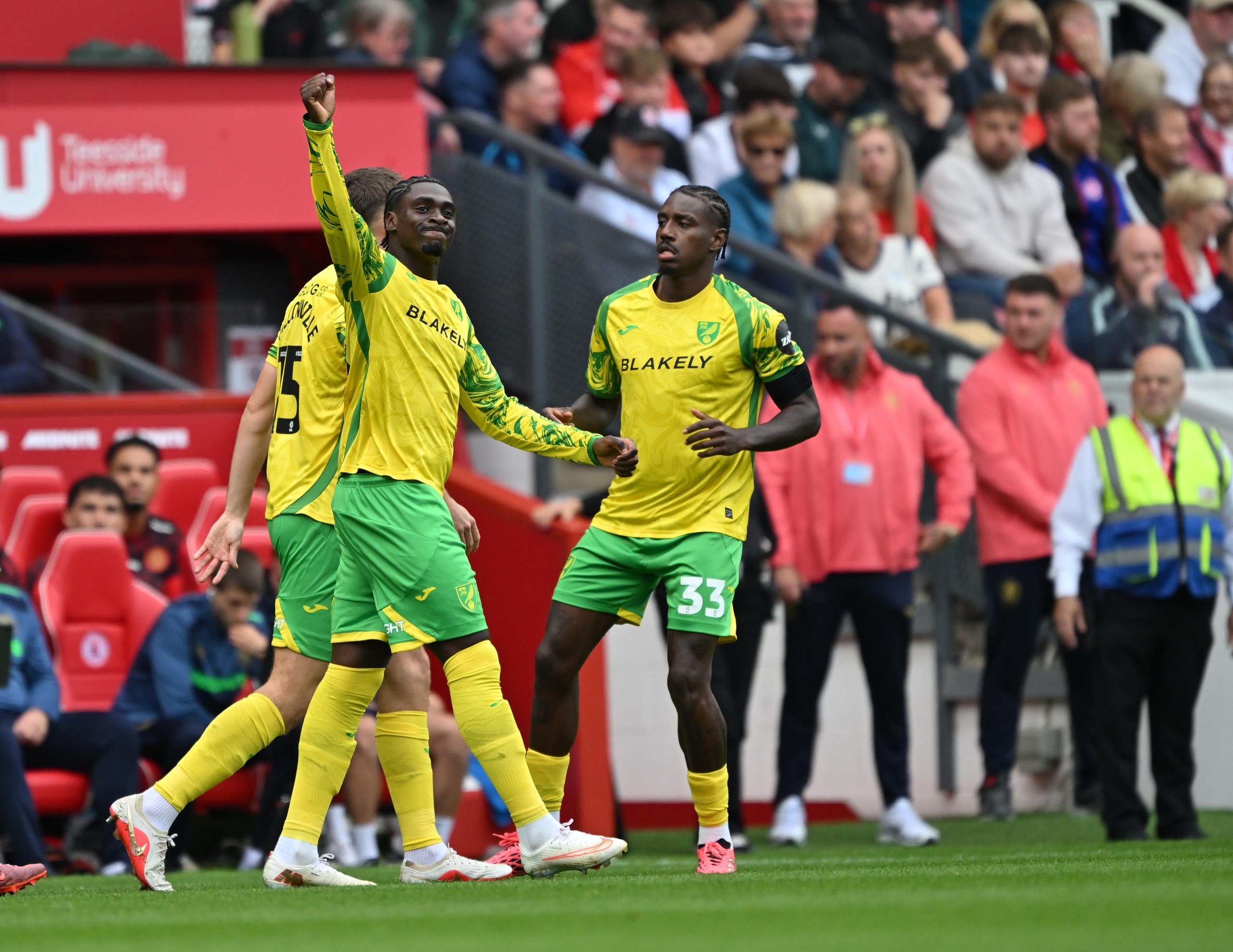 Norwich City's Mohamed Touré (centre) celebrates after giving the visitors a very early lead.