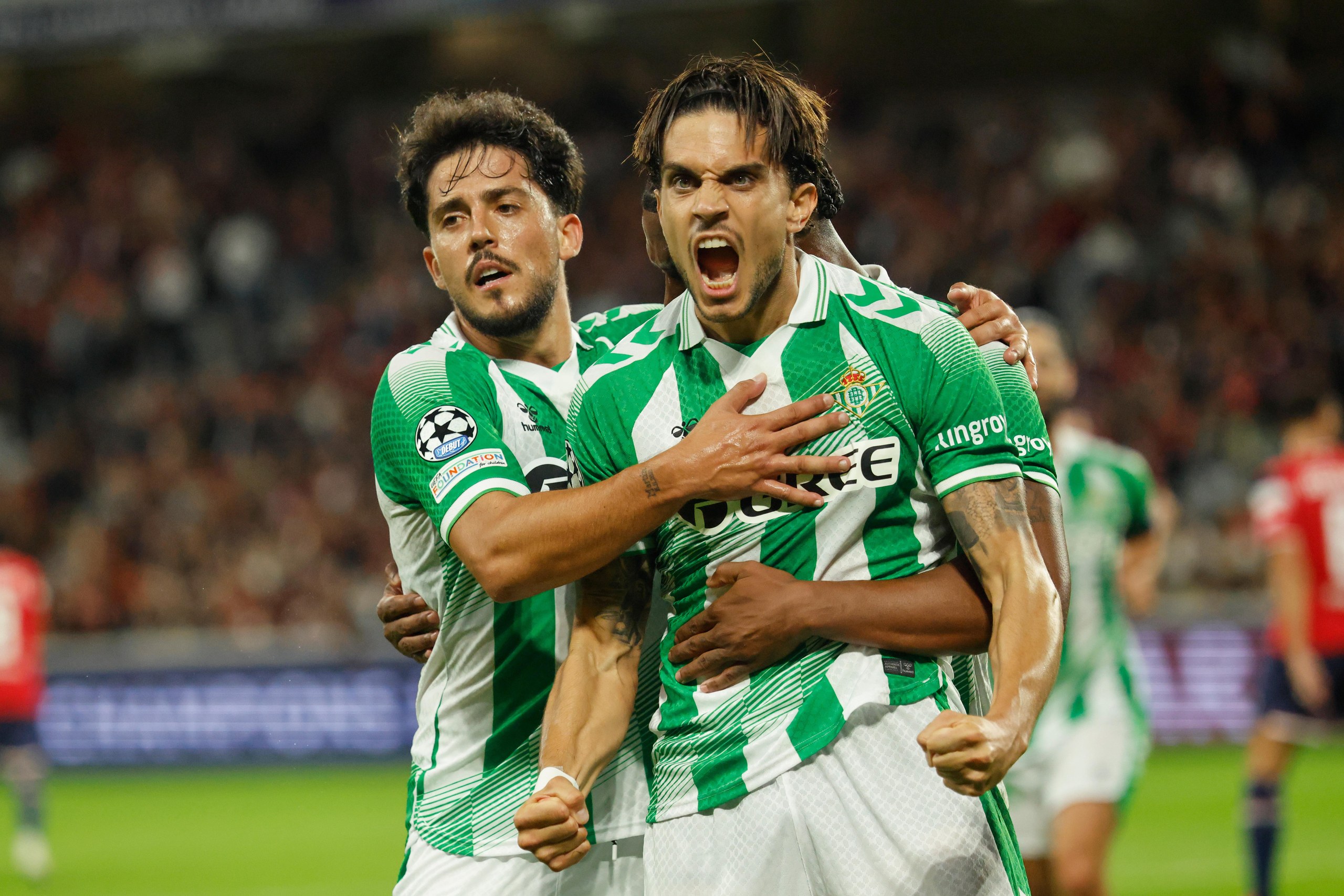 Real Betis' Marc Bartra celebrates after scoring his side's equaliser at Lille.