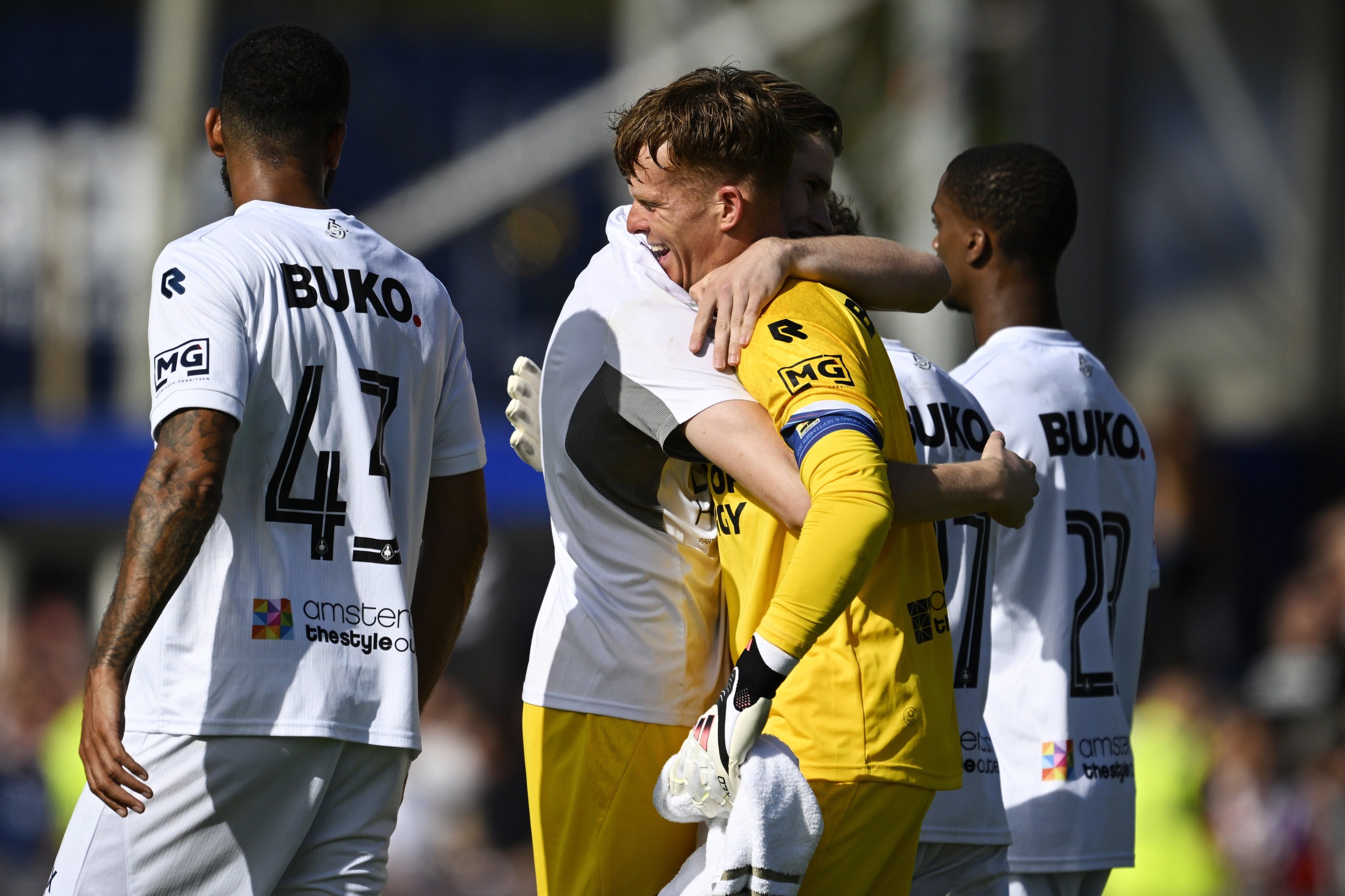 Telstar goalkeeper Ronald Koeman Jr is hugged by a team-mate after his late penalty rescued a point.