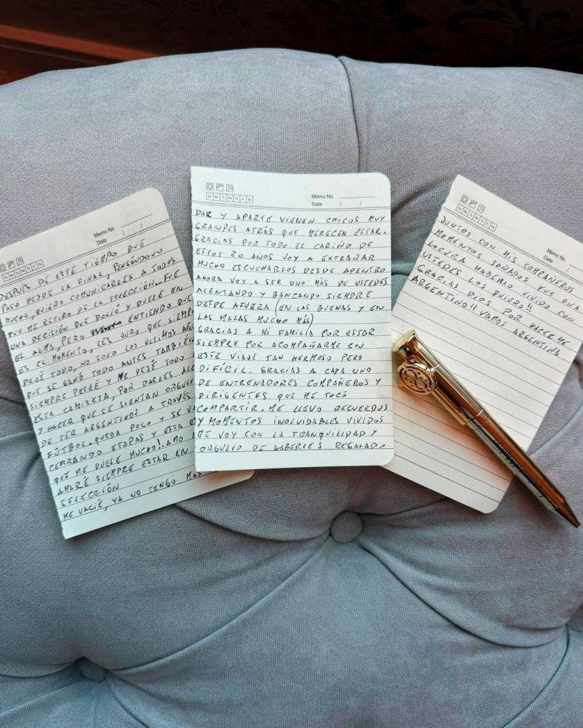 Three notepapers with a handwritten message laying on a chair with a gold pen